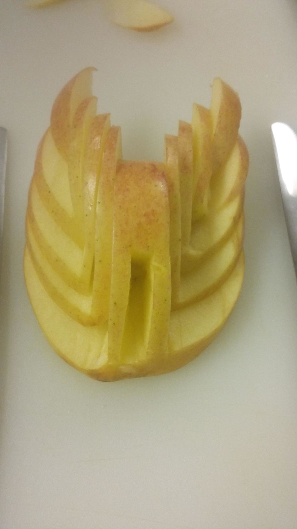 now take the pairing knife and cut a rectangle in the middle to look like this, this will be for the head.