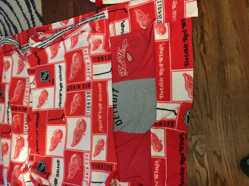 Now, take the rest of your fleece and pin it to your blanket, right sides together (of course). Sew all the way around at 5/8". Leave a hole that's one square wide.