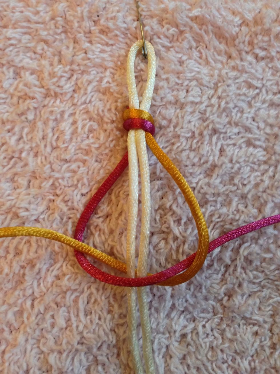 Now take the RIGHT thread, put it UNDER the core threads and through the LEFT thread.