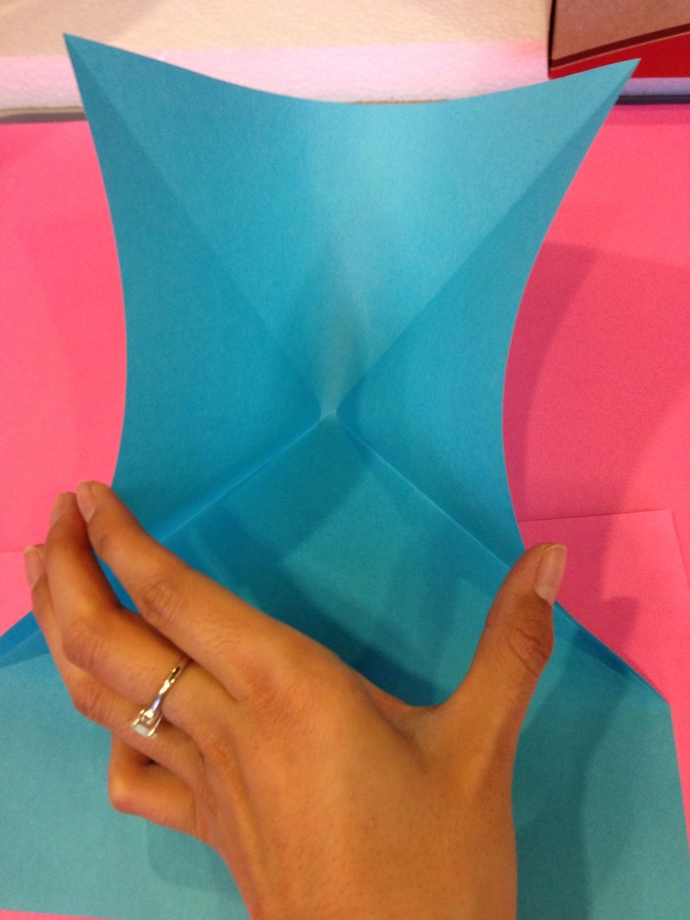 Now take the sides and were going to create a fan shape - this will turn the top into a triangle with flaps on the left and right