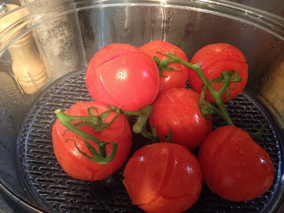 Now take the skin of tomatoes, it should easily come off after boiling