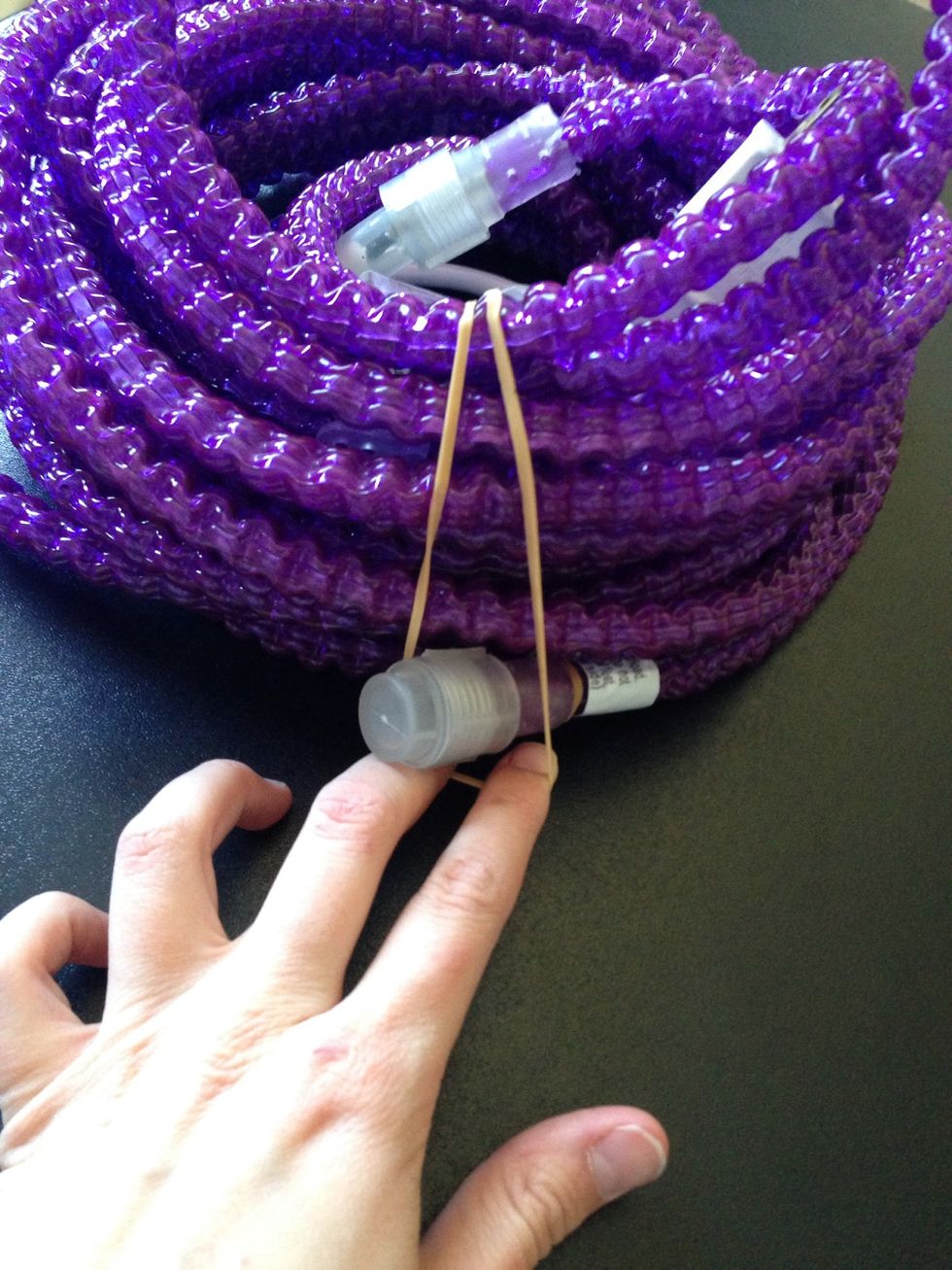 Now take the top part of the cord and feed the end of the lights into it as well.
