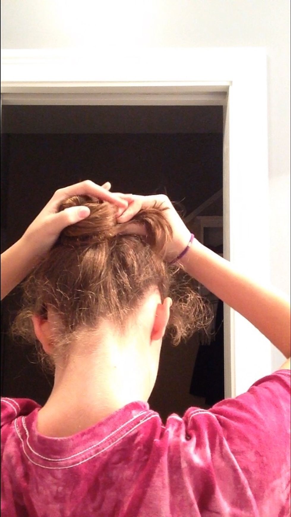 Now take the twisted hair and begin to wrap it around your ponytail until there is no more hair to wrap.