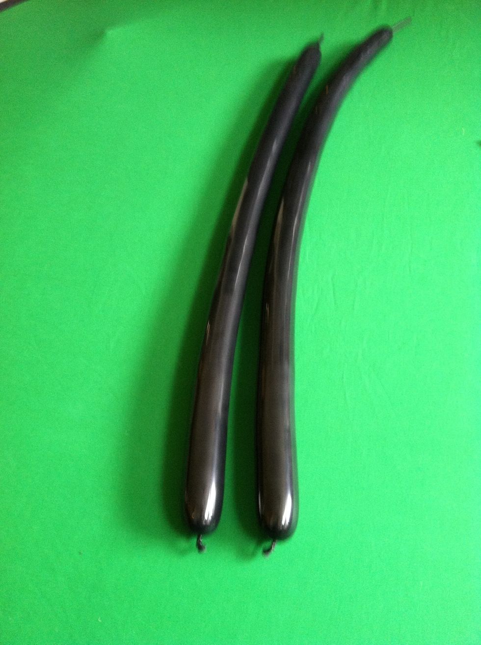Now take the two black balloons