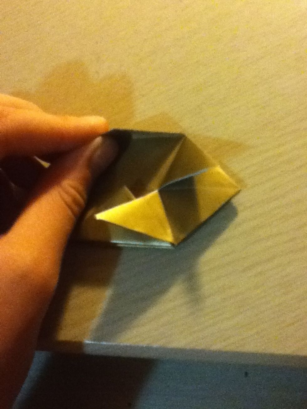 Now take this flap you folded earlier, I find that if you rotate the paper 90 degrees it helps