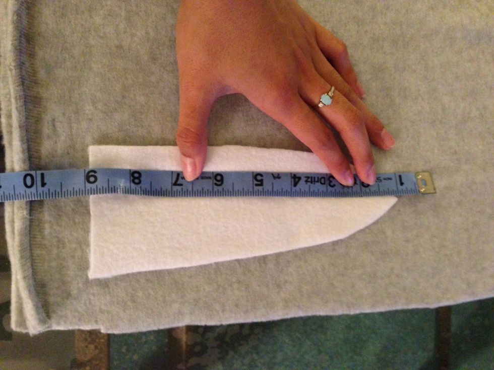 Now take ur donkey inside ear and place it on top of the outside donkey grey fleece. I used the white as a pattern. Measure 1 in away all around the white. That's where we'll cut the outside pieces.