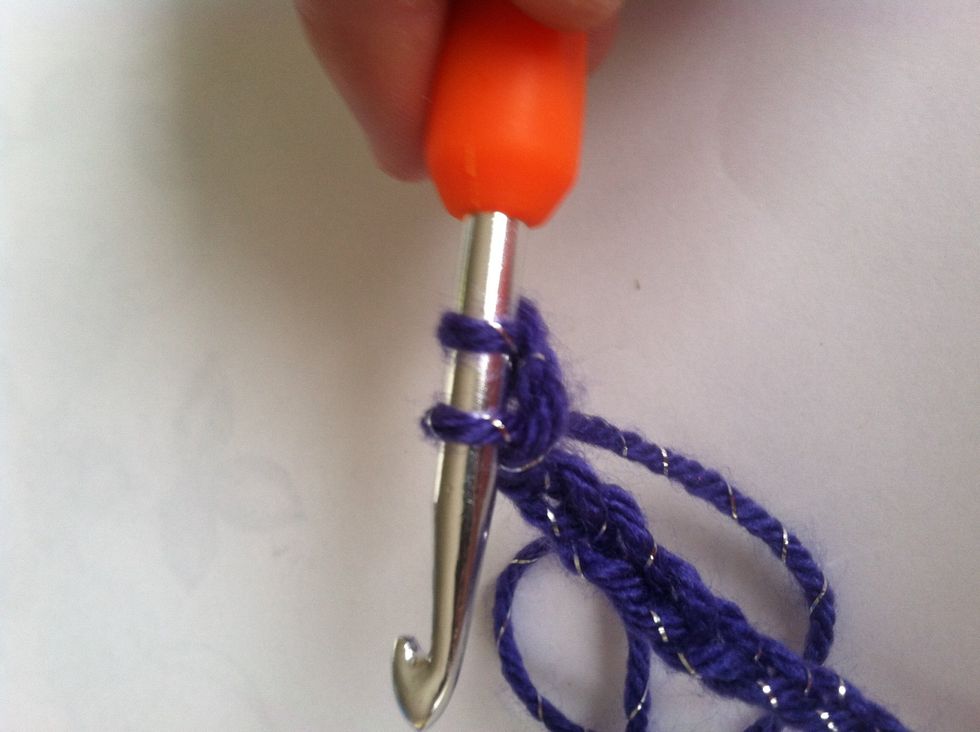 Now take yarn and put over hook and only pull one stitch threw