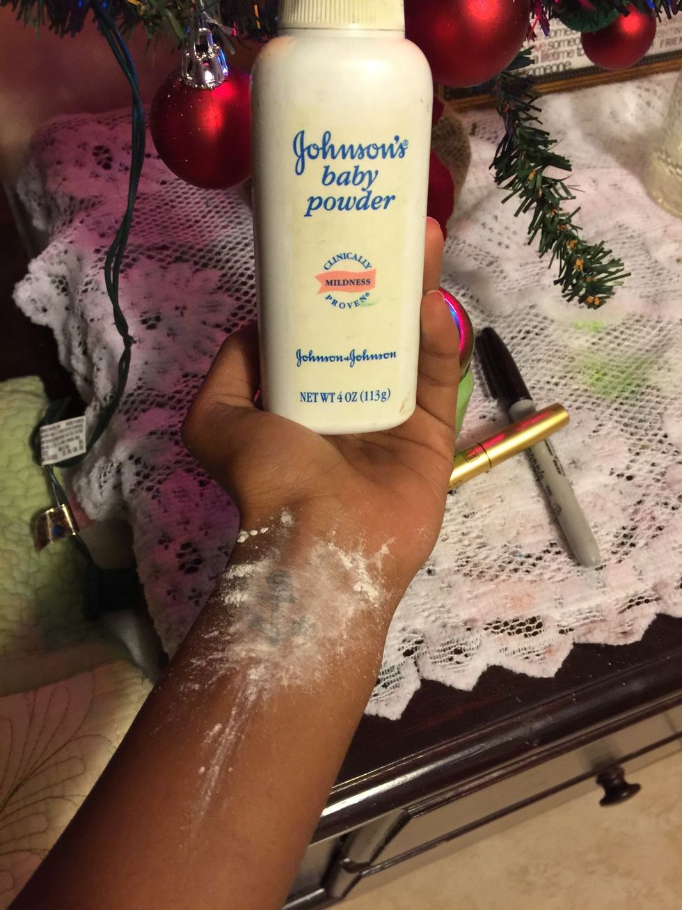 Now take your baby powder and put that on to your tattoo the baby powder acts to set your tattoo.