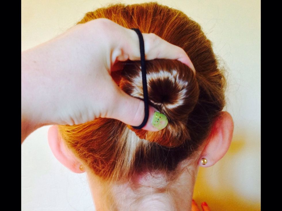 Now, take your band and wrap it around your hair as you would for a normal ponytail