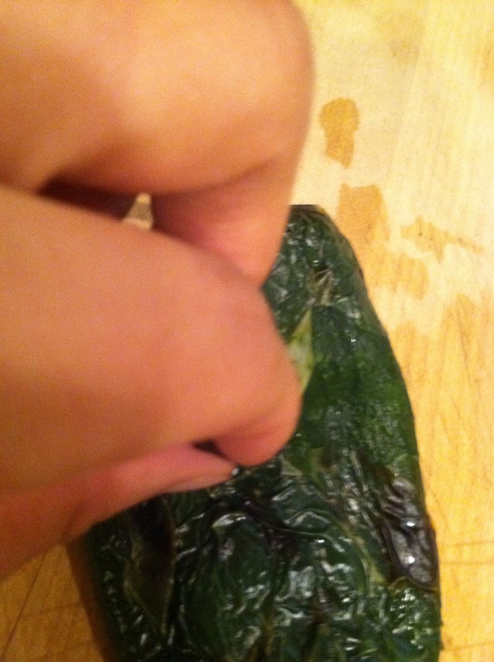 Now take your chiles and peel off the skin.