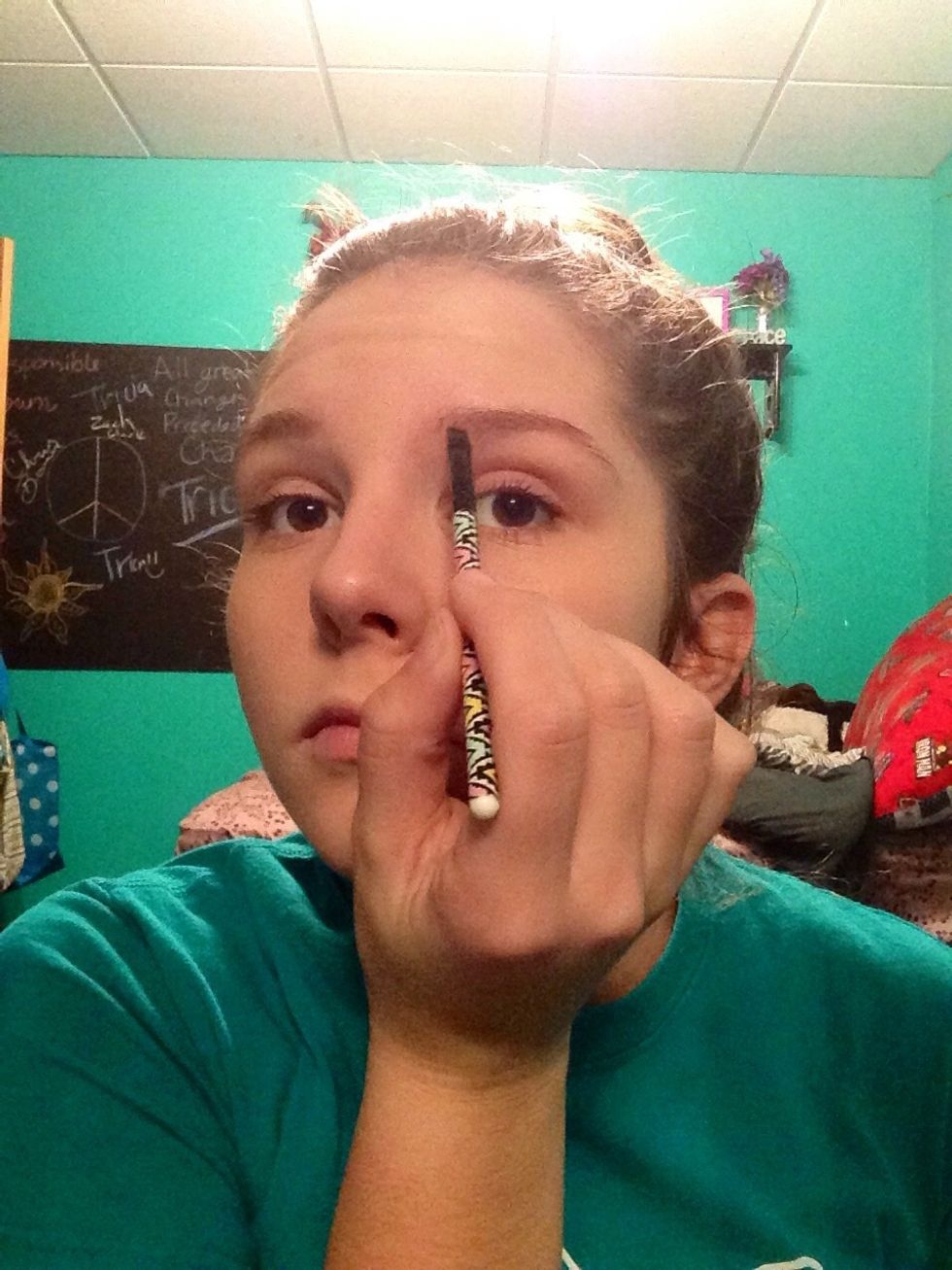 Now take your eye brow filler, I prefer powdered filler, and spread evenly through your brows. Be sure to evenly fill, it's all about symmetry.