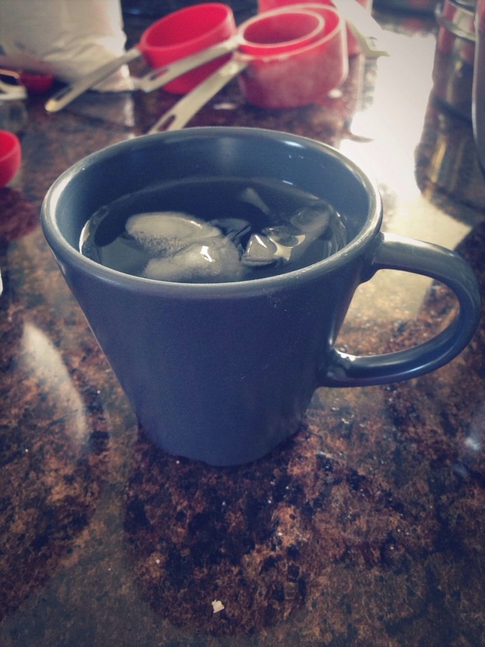 Now, take your ice water and sprinkle it on the dough followed by a quick toss with a fork.