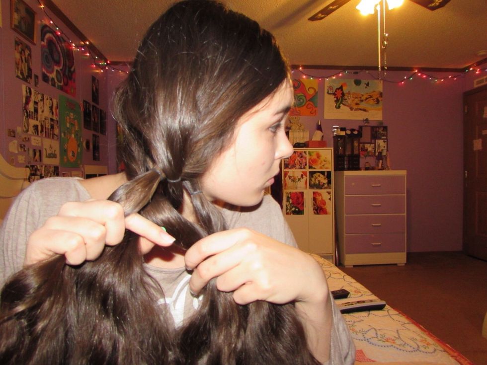 Now take your left-most strand and place it underneath the strand closest to it. (Inner left)