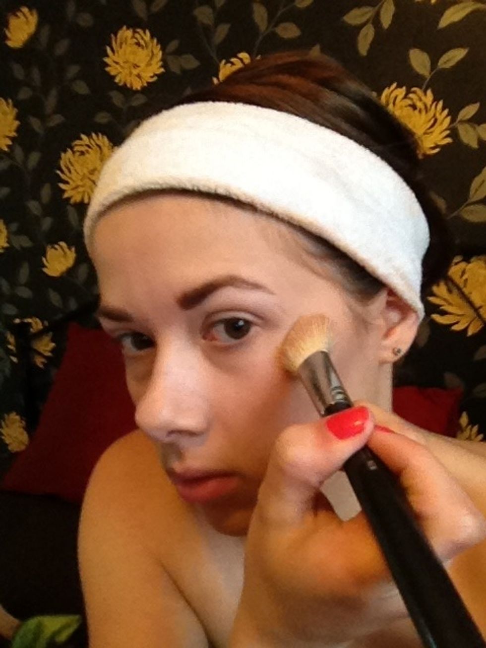 Now take your lightest colour (highlighter) and place on top of the cheekbones using a downward stroke motion towards the apples of the cheeks