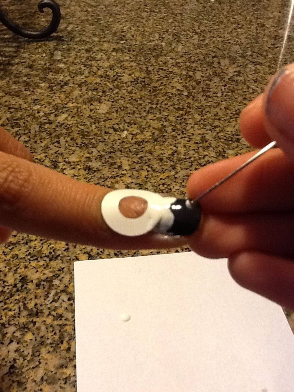 Now take your nail dotter or pencil and add three dots ( to look like buttons )