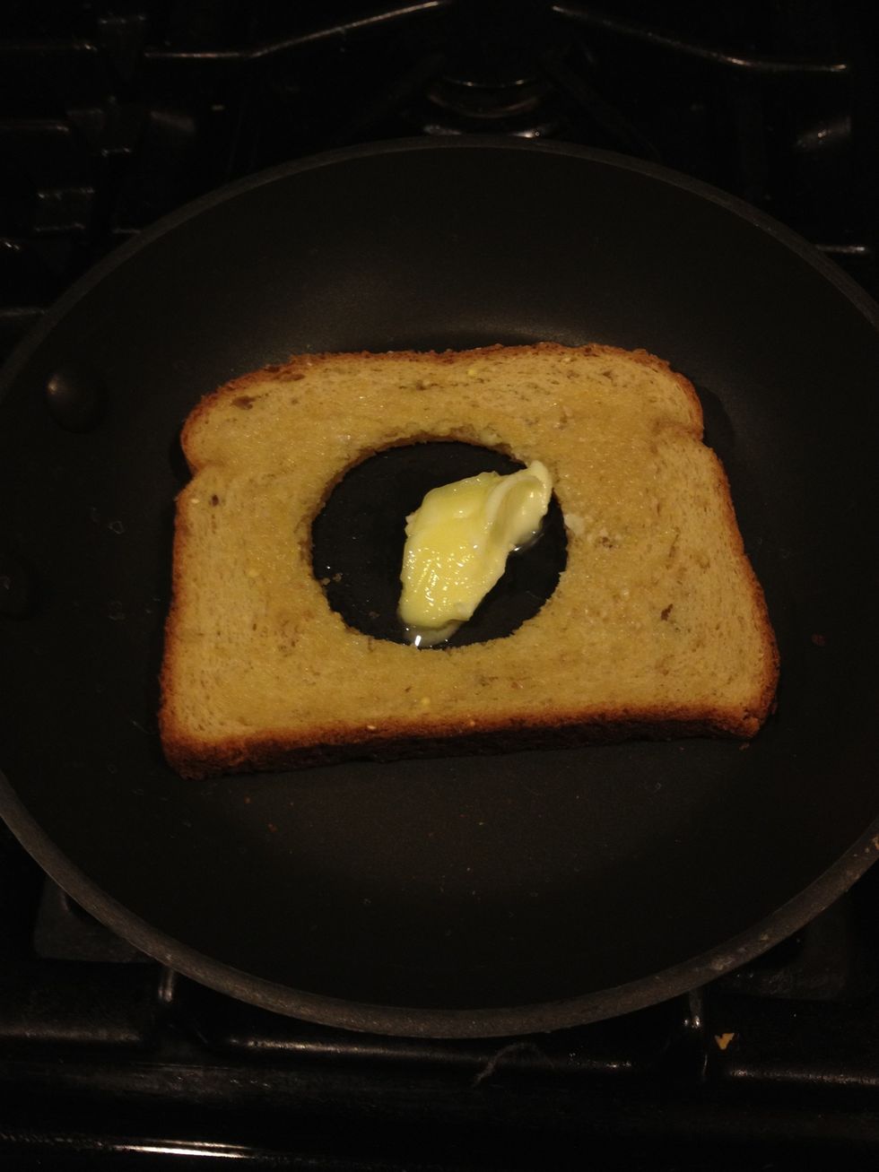 Now take your pan, heat it up and place the bread in the pan with a teaspoon of butter in the middle.