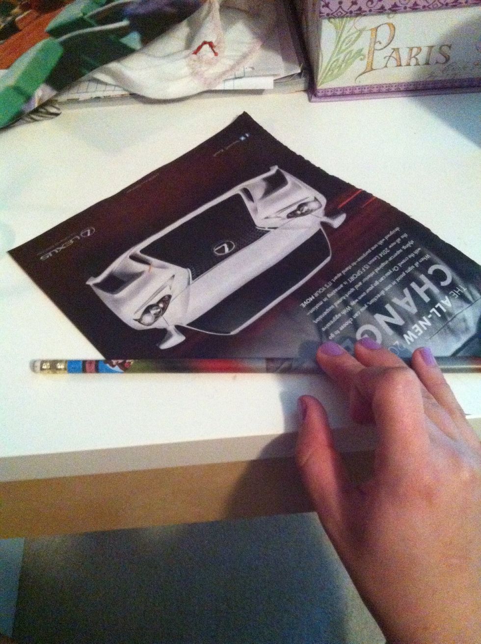 Now take your pencil and roll the magazine from the corner... Make sure as you roll to take the pencil out so it doesn't get stuck inside the roll