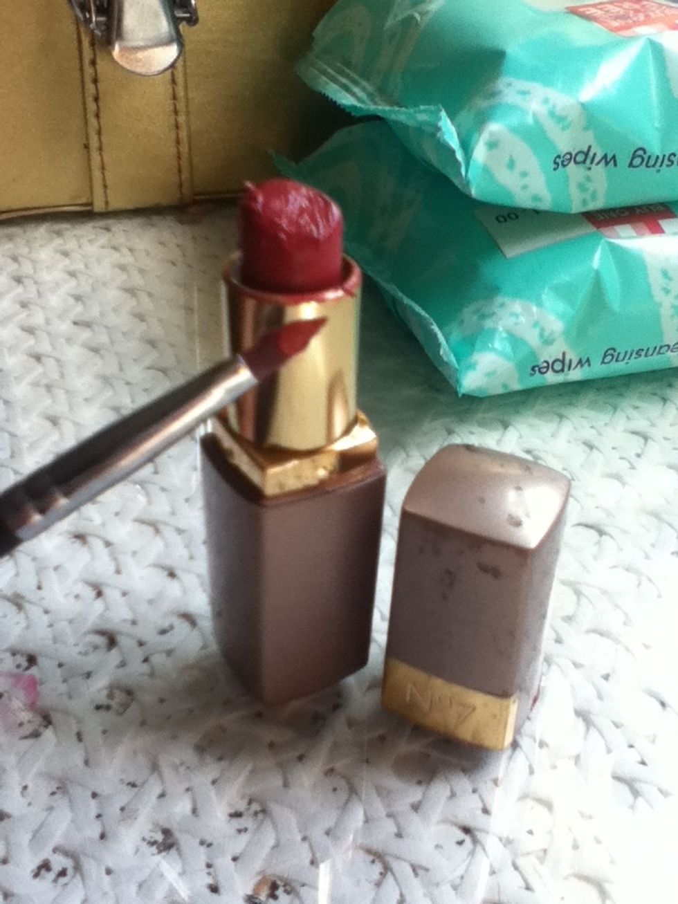 Now take your red lipstick and a lip brush.