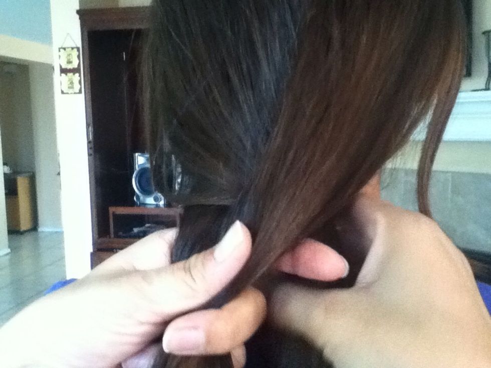 Now take your right side strand and place it in the middle. Don't let go of your hair.
