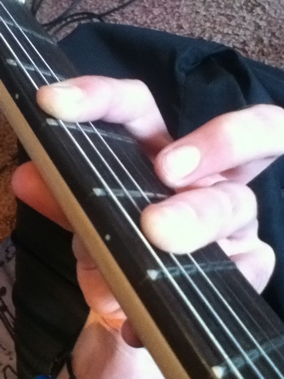 Now take your ring finger and place it two frets down and one string Down.