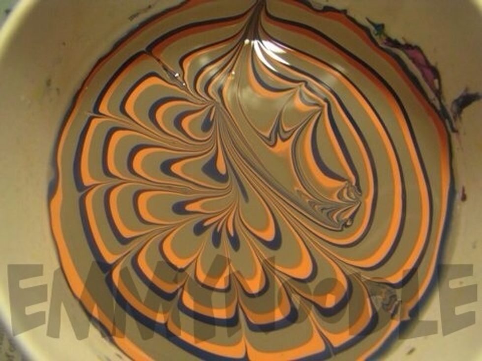 Now take your toothpick and drag it towards the center with a very light touch and repeat until you've made a good amount of petal shapes.