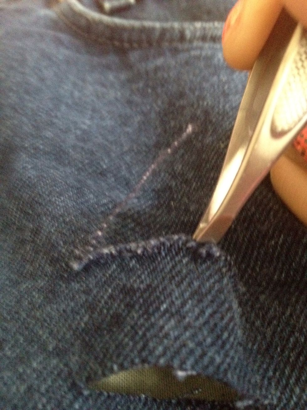 Now take your tweezers and pull off a string from the cut. It'll take a few tries but once you get one, they'll all be easy to come off. Tip: start in the center.