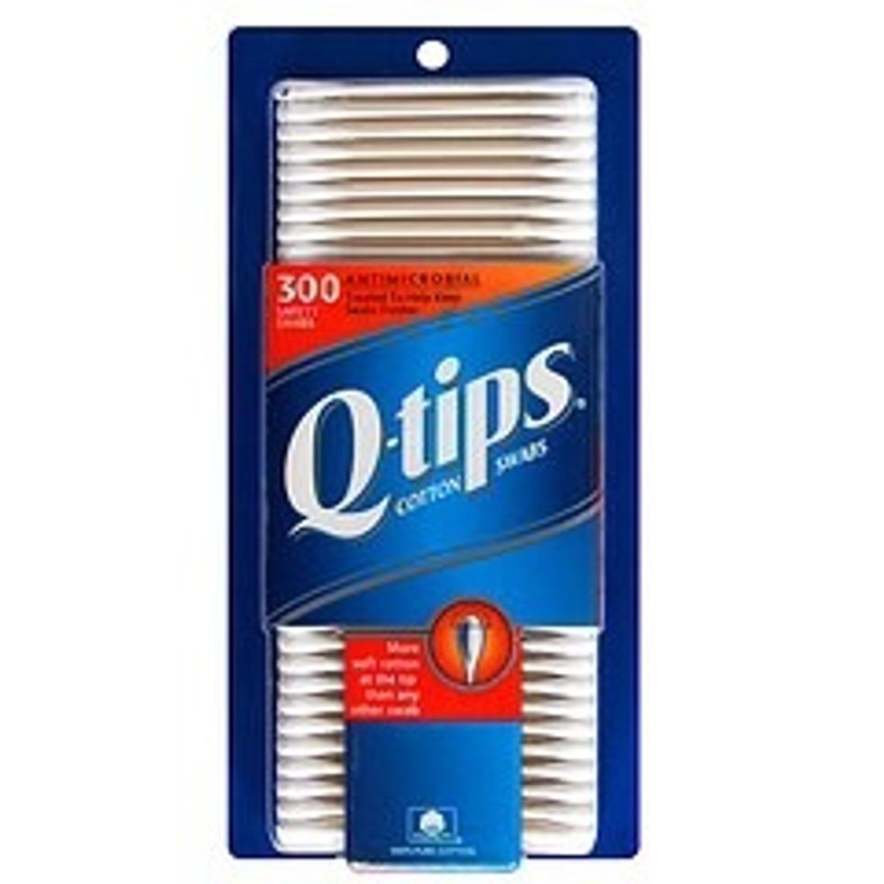 Now taking your Q-tips, take some nail polish remover and remove any excess polish on the skin or any other place where there shouldn't be polish.