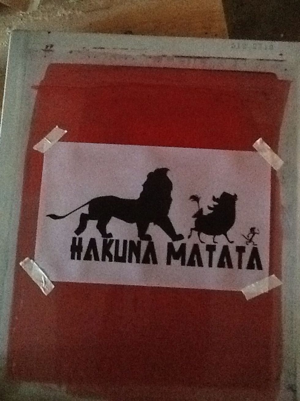 Now tape the vellum paper on the screen. This should still be done in a dark area.