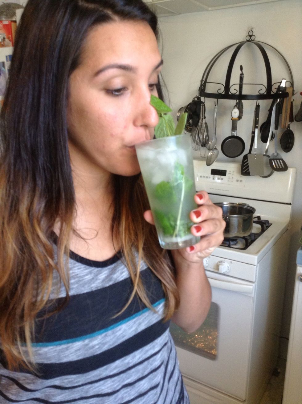 Now taste! That's my daughter/bartender who perfected her mojito-making skills during a recent visit to see her Cuban relatives on the island. You can use a straw if you have one. We didn't...
