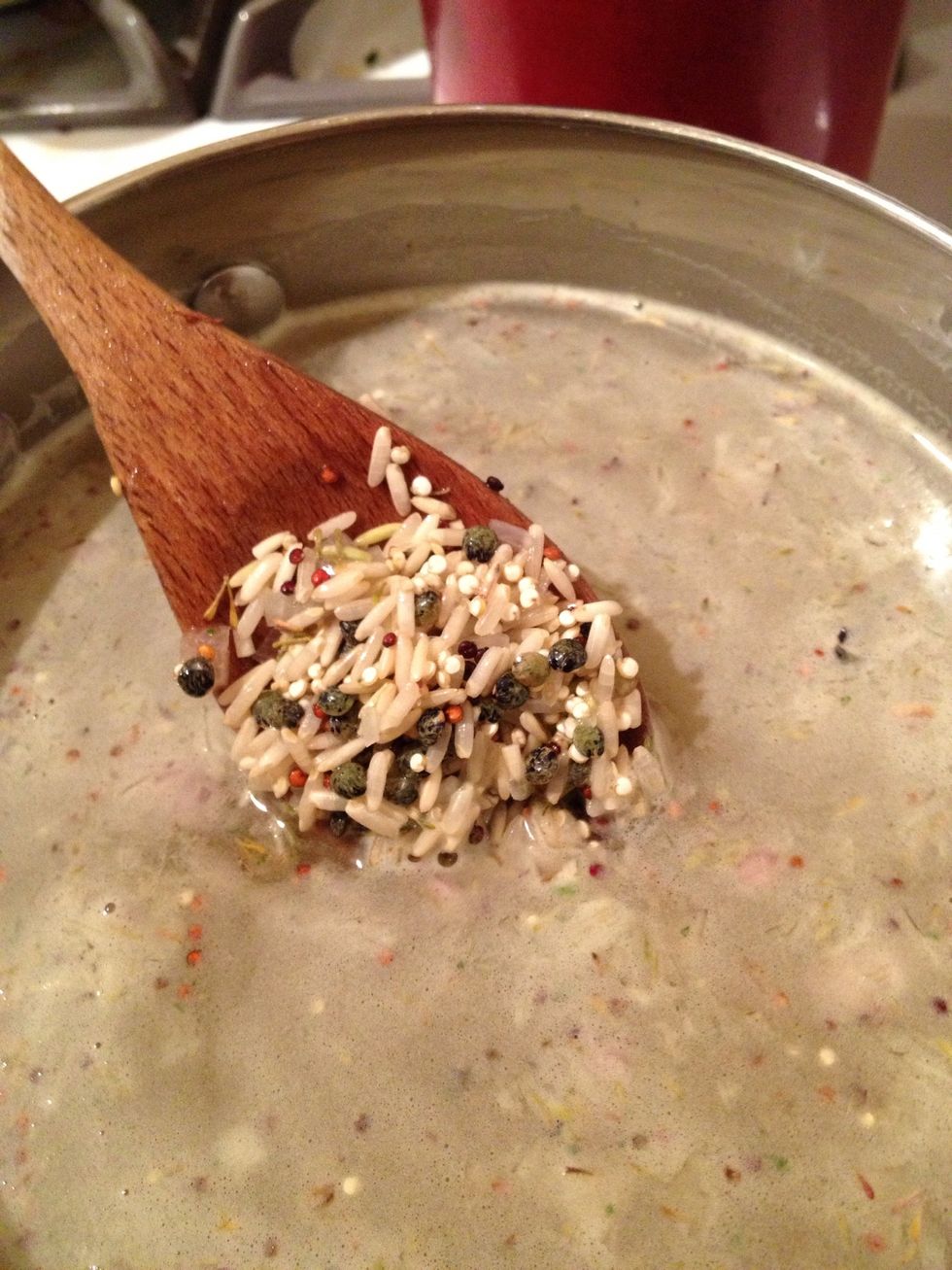 Now that everything is in one pan, heat it until it begins to boil. Turn the heat down and cover the pan. Keep the heat quite low, so that the pilaf can cook completely, without bubbling over.