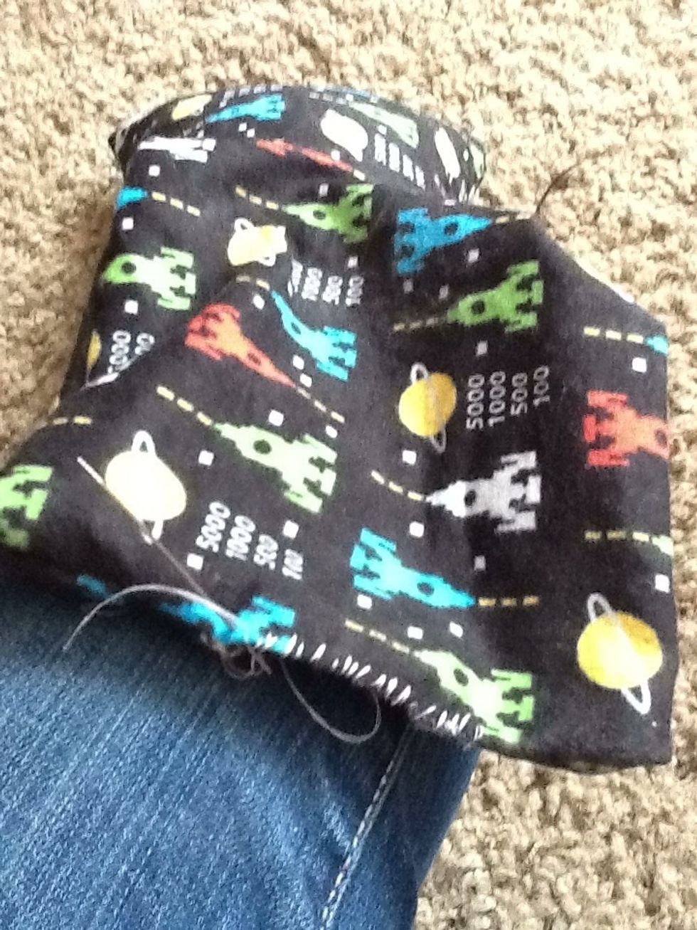 Now that it's full, sew the small opening shut, I don't bother hiding my stitch. I want to make sure it is sewn very well! You don't want corn spilling out at you!