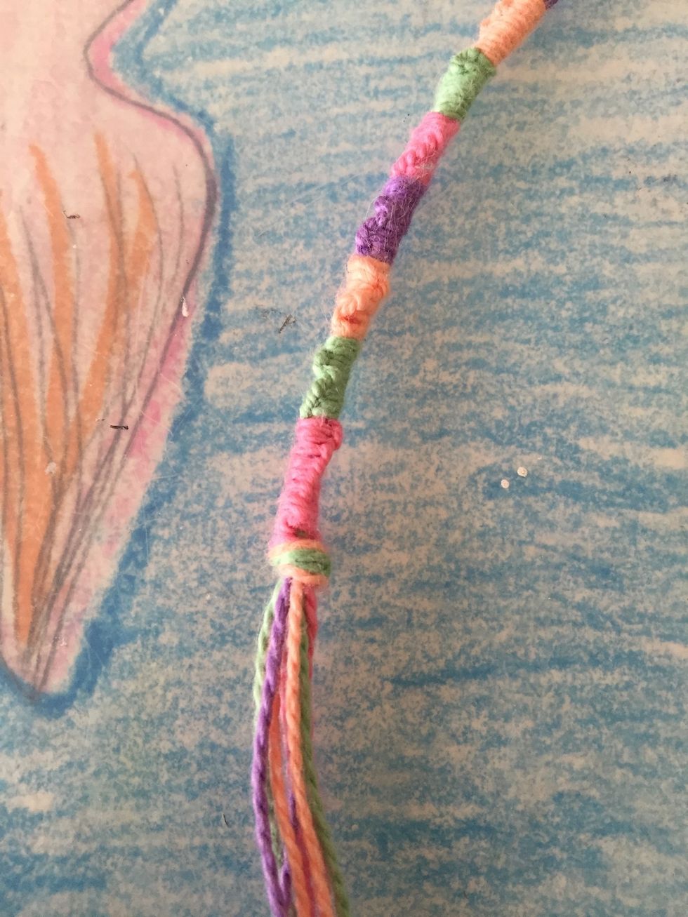Now that my bracelet is long enough to wrap around my wrist I tied a knot so it wouldn't fall apart