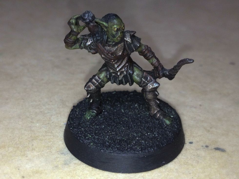 Now that the primer has dried, you may begin painting the base.