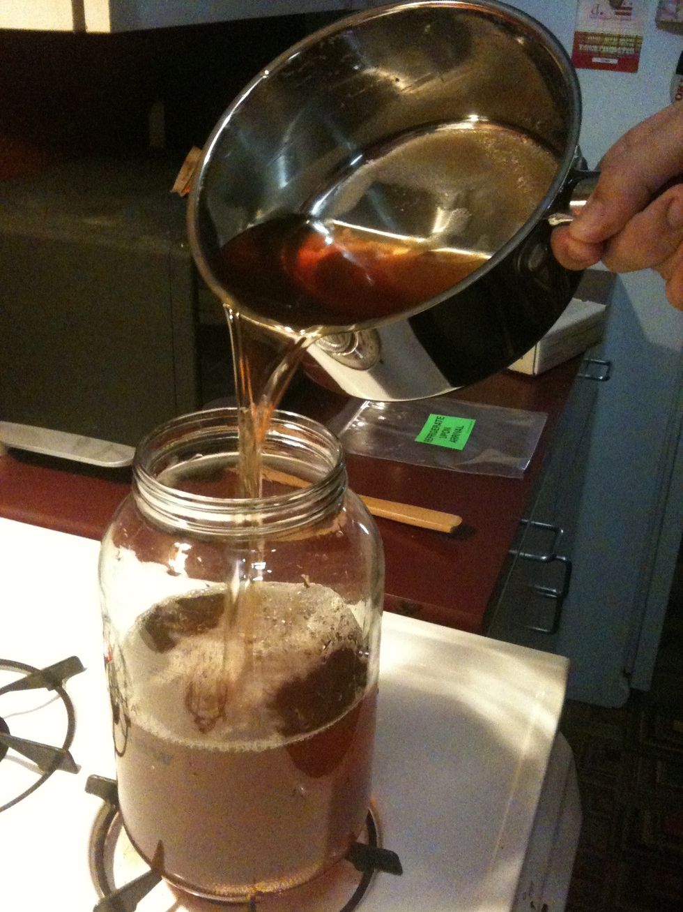 Now that the tea has cooled down, pour it into the 1 gallon glass jar. It is important to remember that the jar, pot, and utensils should all be well cleaned so as to avoid the risk of contamination.