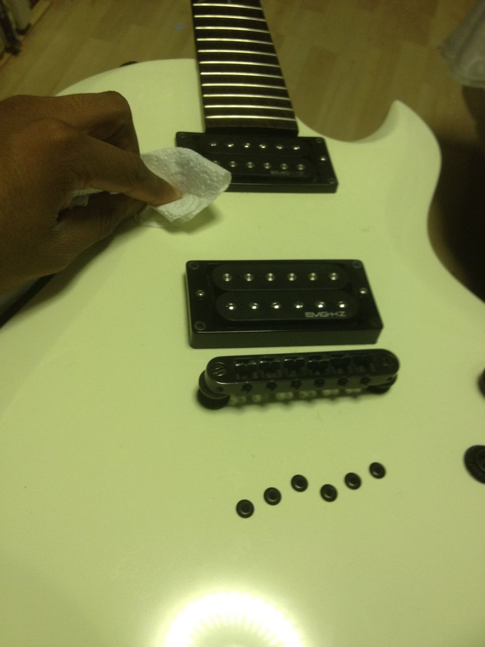 Now that your guitar had no strings on it, use this time to clear any dust that may be trapped underneath it. A fine spray of furniture polish over the fretboard also works a treat