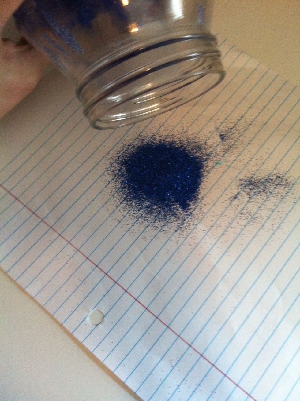 Now that your have spread the glitter out poor the excess out so it doesn't clump in your jar.