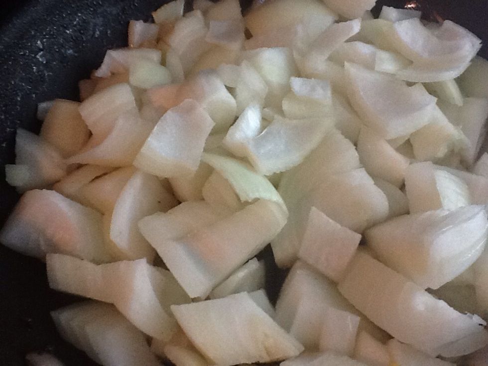 Now the add the onions to the man and change the heat setting to medium low. Allow the onions to cook stirring occasionally.