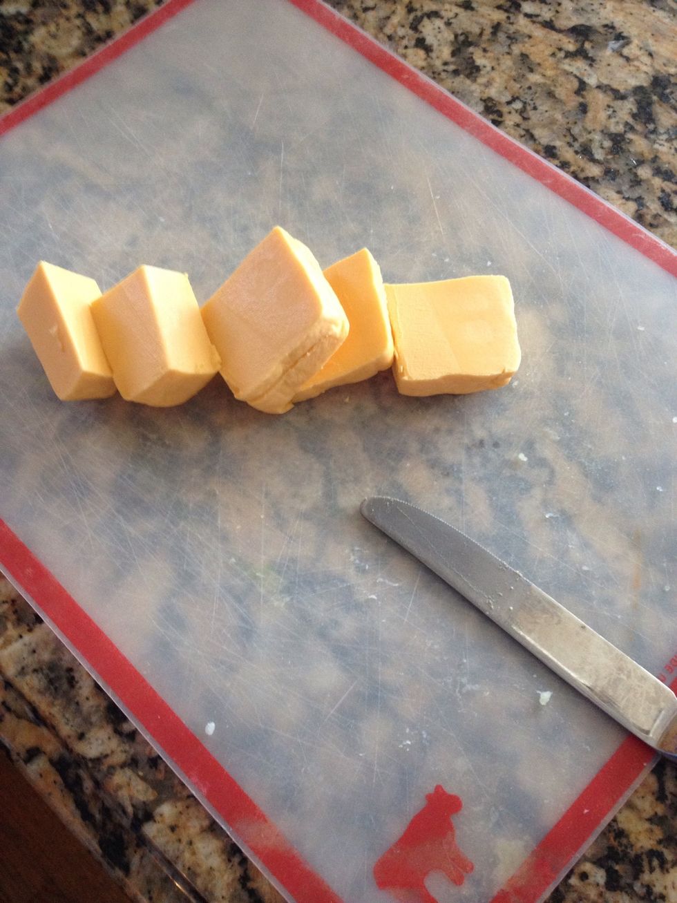 Now the cheese. Cheese type is up to you but for me, I use velveta. Nothing melts as creamy as velveta so its my go to for cheesy (even tho its really not cheese) add as much as you like