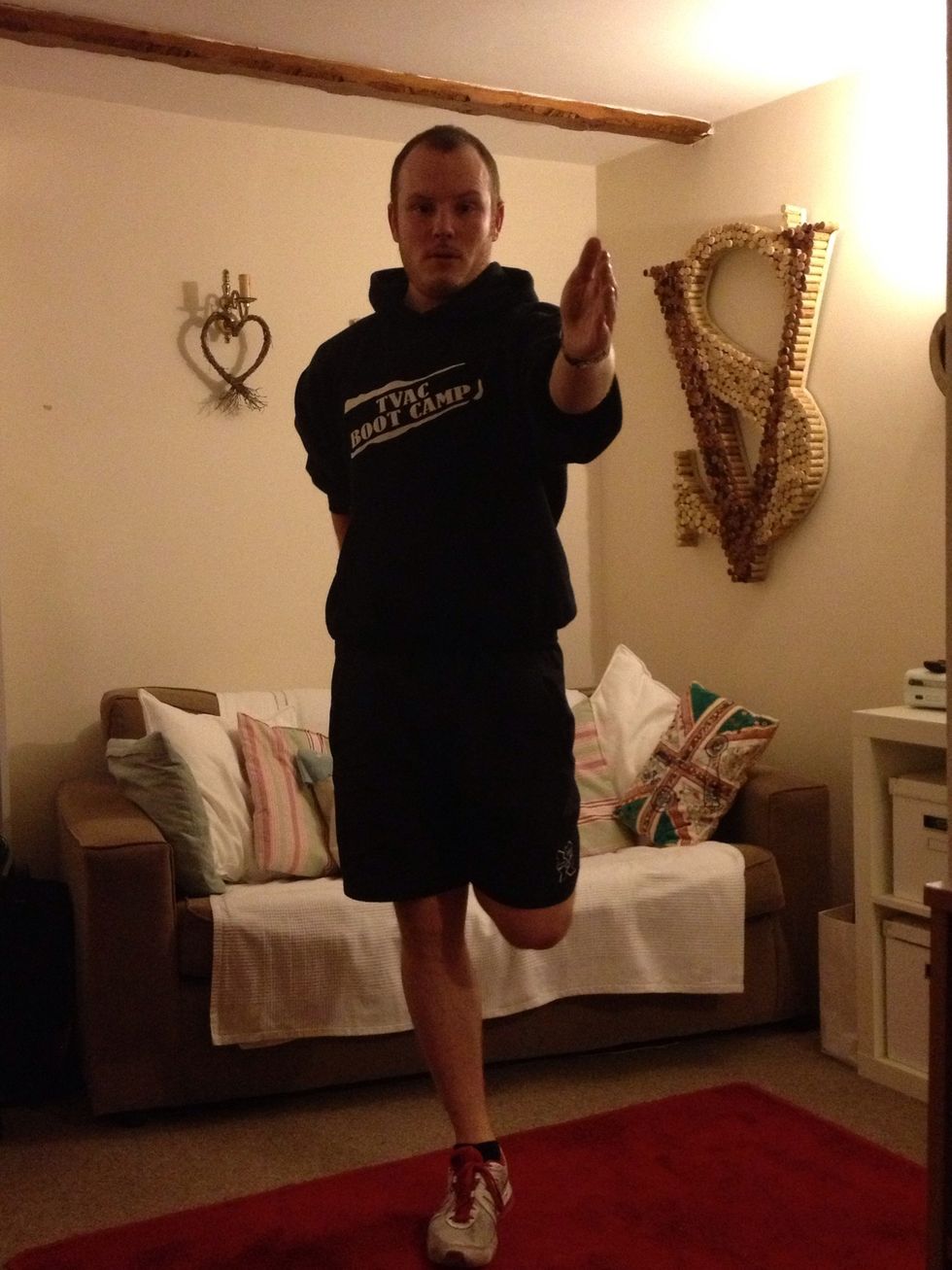 Now the flamingo stretch - hold one leg and keep your balance - knees close, back straight and chest out