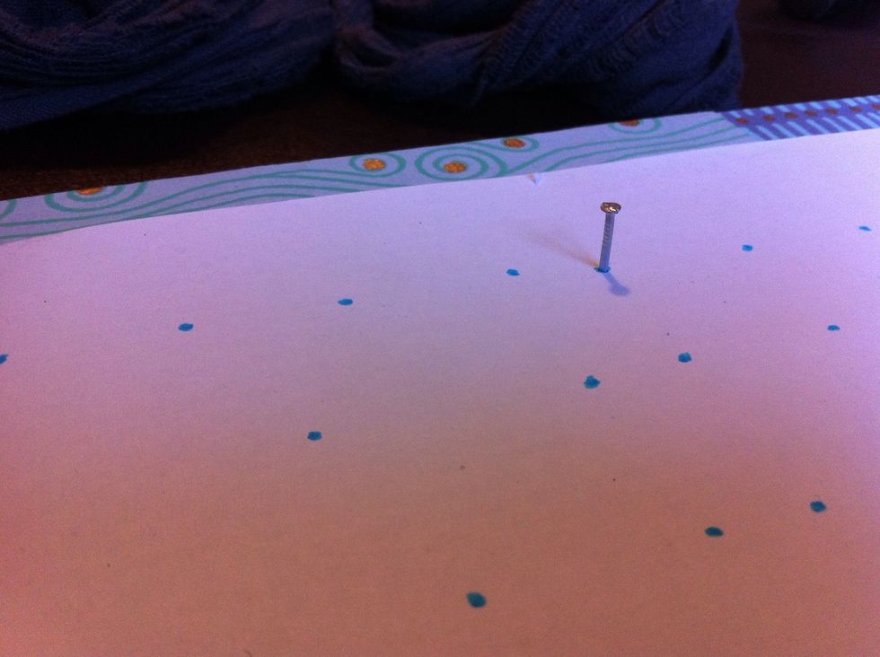 Now the fun bit! Pick a dot and start hammering in the nails. The depth is up to you but stay consistent.
