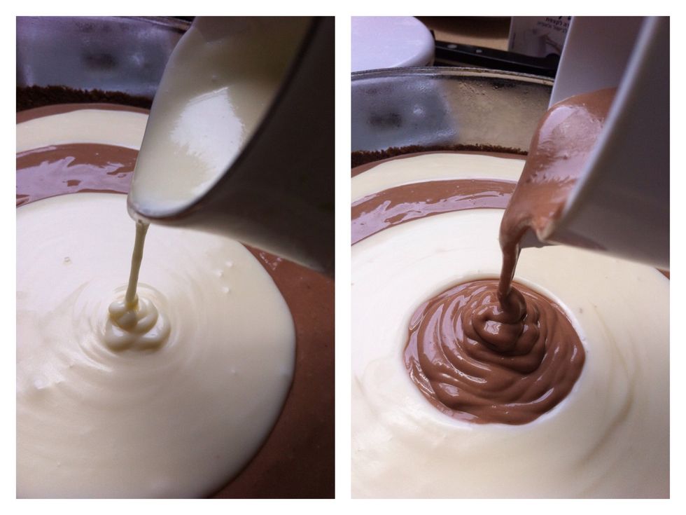 Now-The fun part! Put each cream in a jug, or a cup, anywhere that will make it easier for you to pour the cream onto the cake slowly and focused...