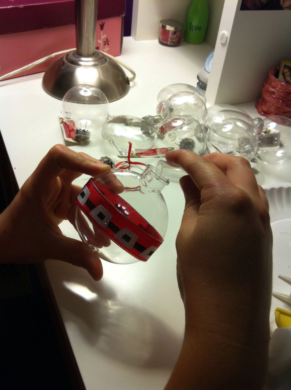 Now the fun part! Take glitter, beads, or excess ribbon or anything else and put them inside the ornament!!