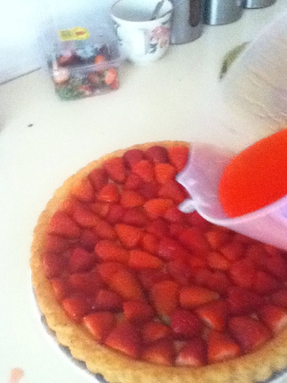 Now the jelly is a little bit thick pore it over the  flan