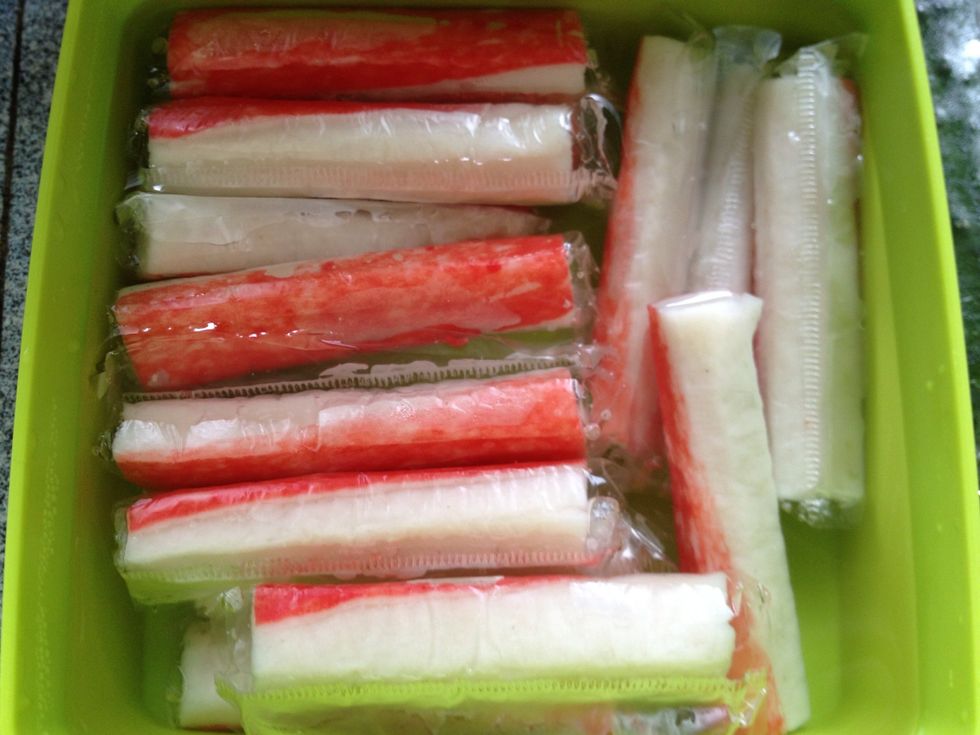 Now the kani mayo - Boil water and put the crab sticks in the boiled water for a couple of minutes. I simply put the crab sticks in a boiled water & cover the container for a while