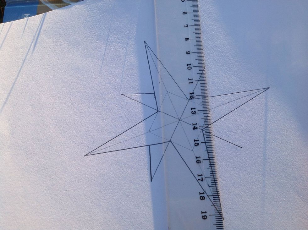 Now, the little star "behind" the big star. Make a straight line from the tip of the star to the corner of the square.