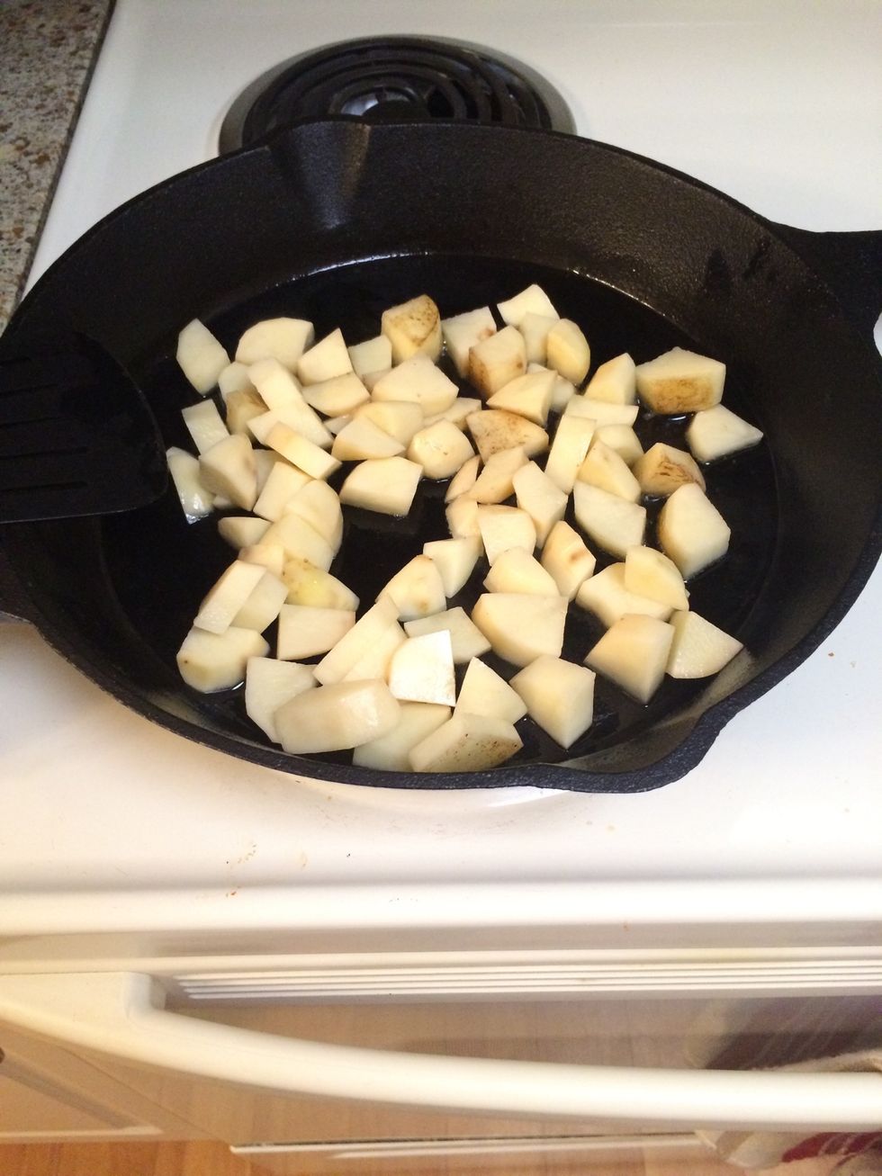 Now the oil should be hot enough. Go ahead and add potatoes