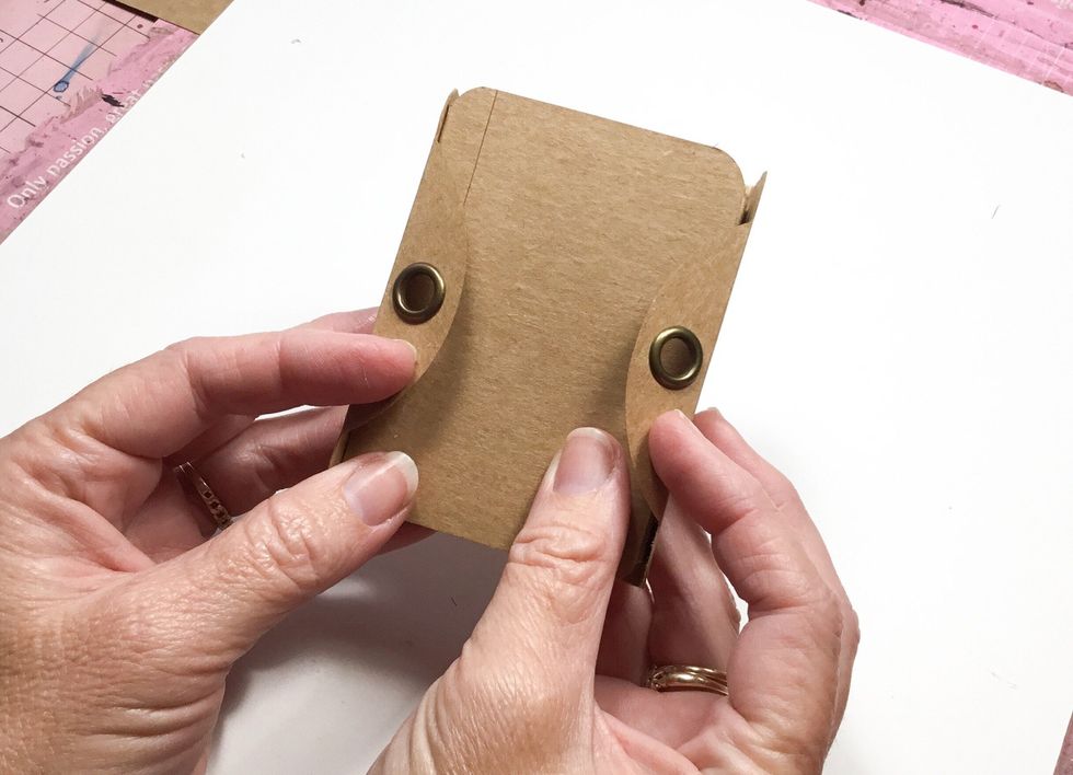 Now the tag tops should fold around as shown. These will now help to hold the inside album closed.