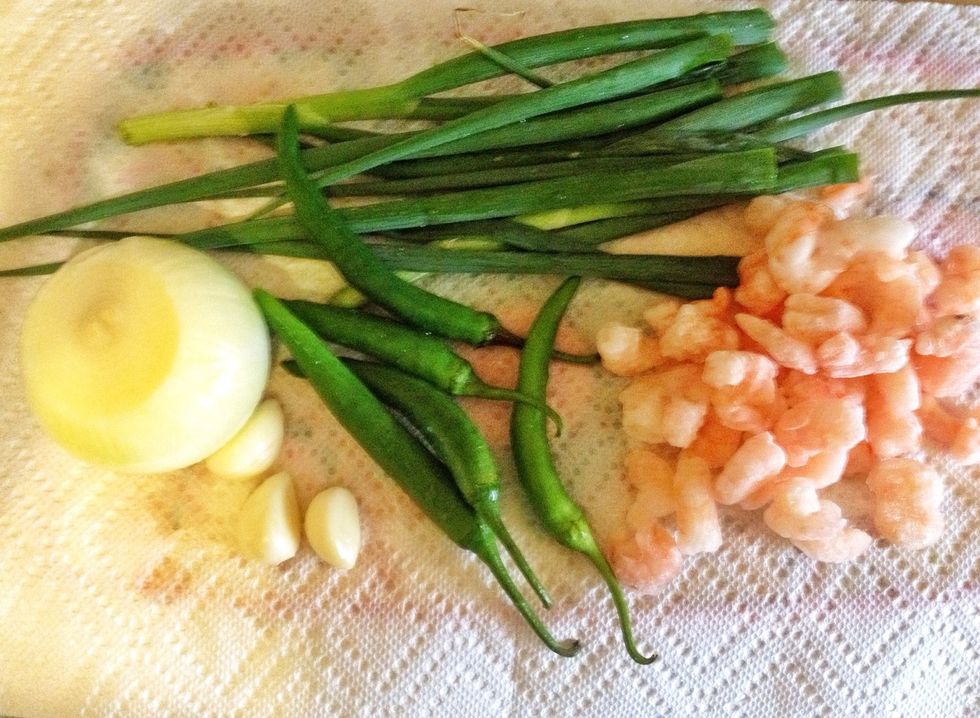Now these are all the ingredients that will go in to the batter. Chop the shrimps finely along with onion, garlic, green scallions and the peppers. These are all homegrown peppers and scallions! :)