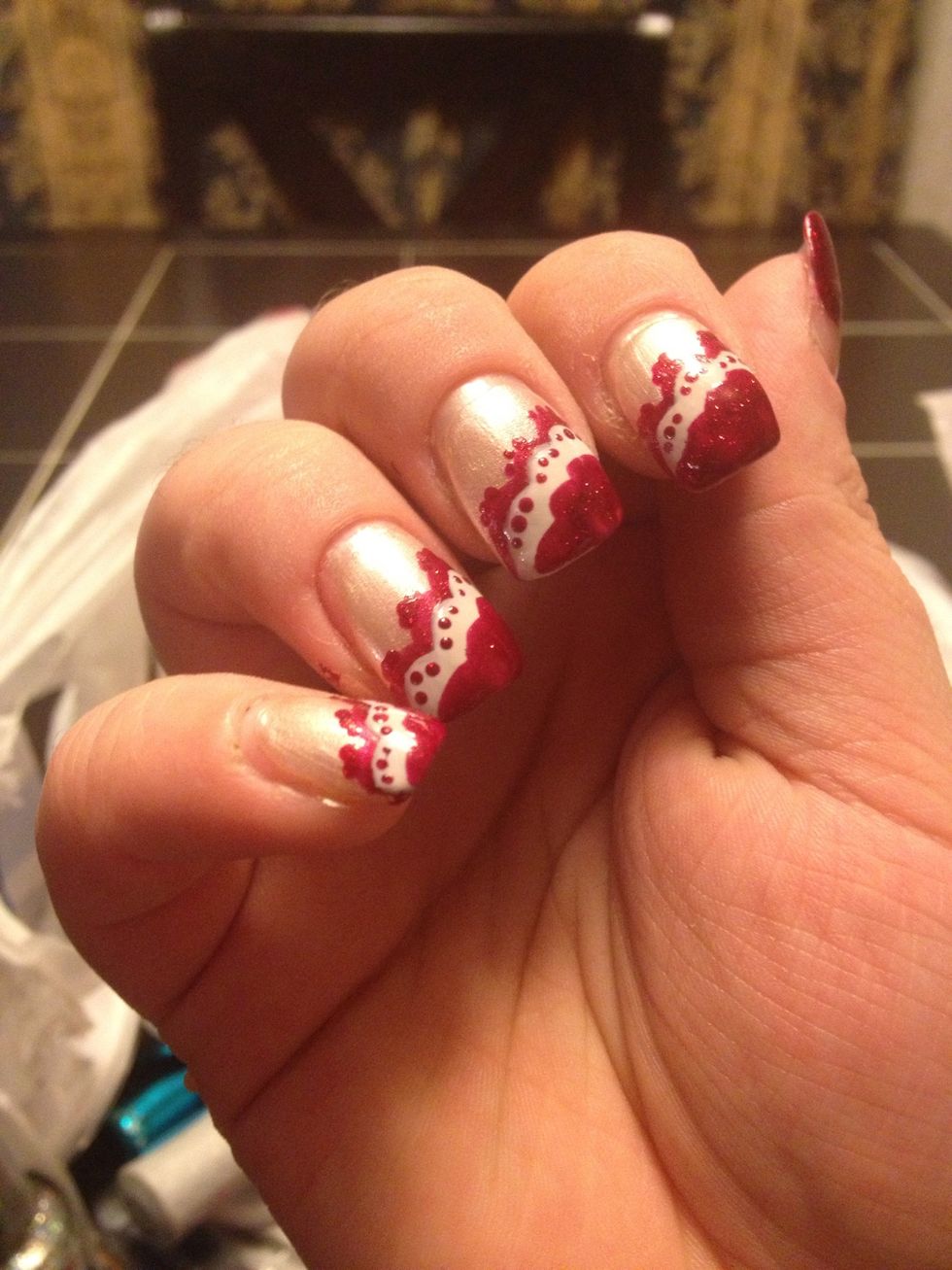 Now this is for those who want great detail, and don't mind the extra work. You will need longer nails for this to work properly.  Add red lines over the white, using the same steps as you did before