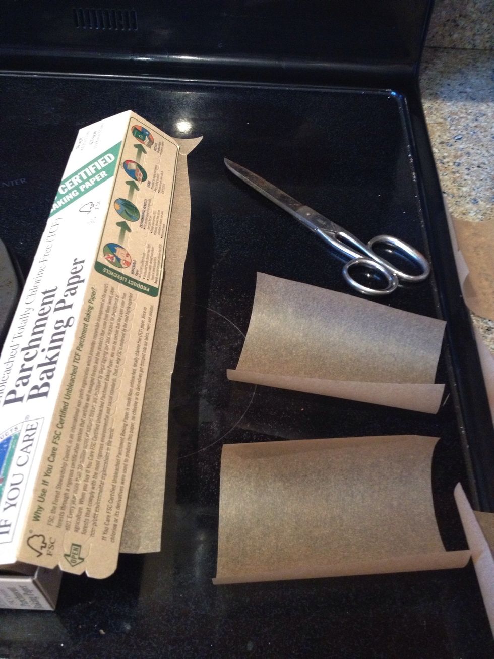 Now this is my way to get a clean brownie bite outta the pan, but you can just use your PAM... I just like my parchment paper better. So, I cut squares out....